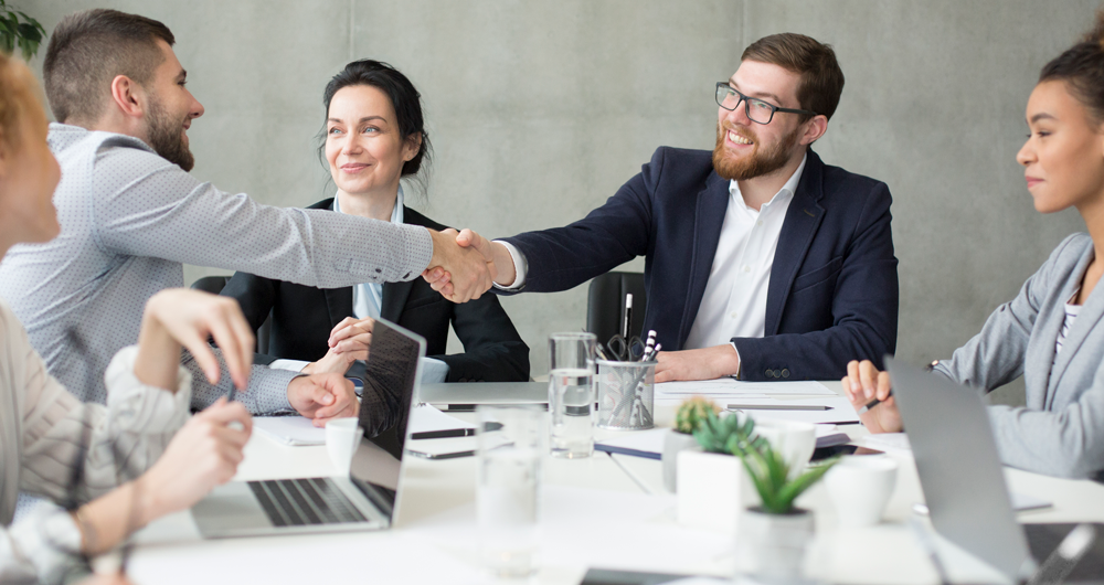 boss-shaking-hands-with-employee-at-meeting-2021-08-30-02-33-45-utc