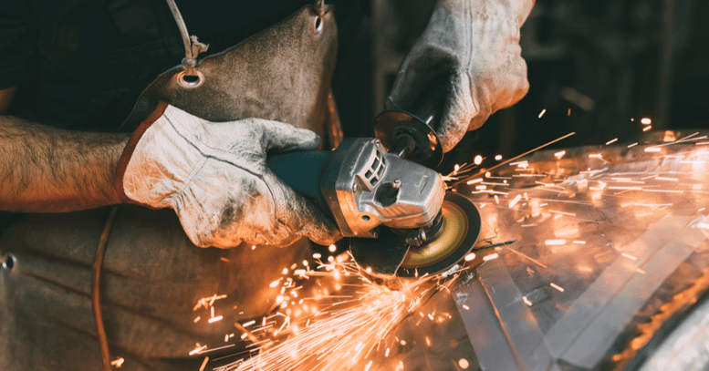 hands-of-metalworker-grinding-copper-in-forge-work-2022-03-07-23-55-48-utc-1